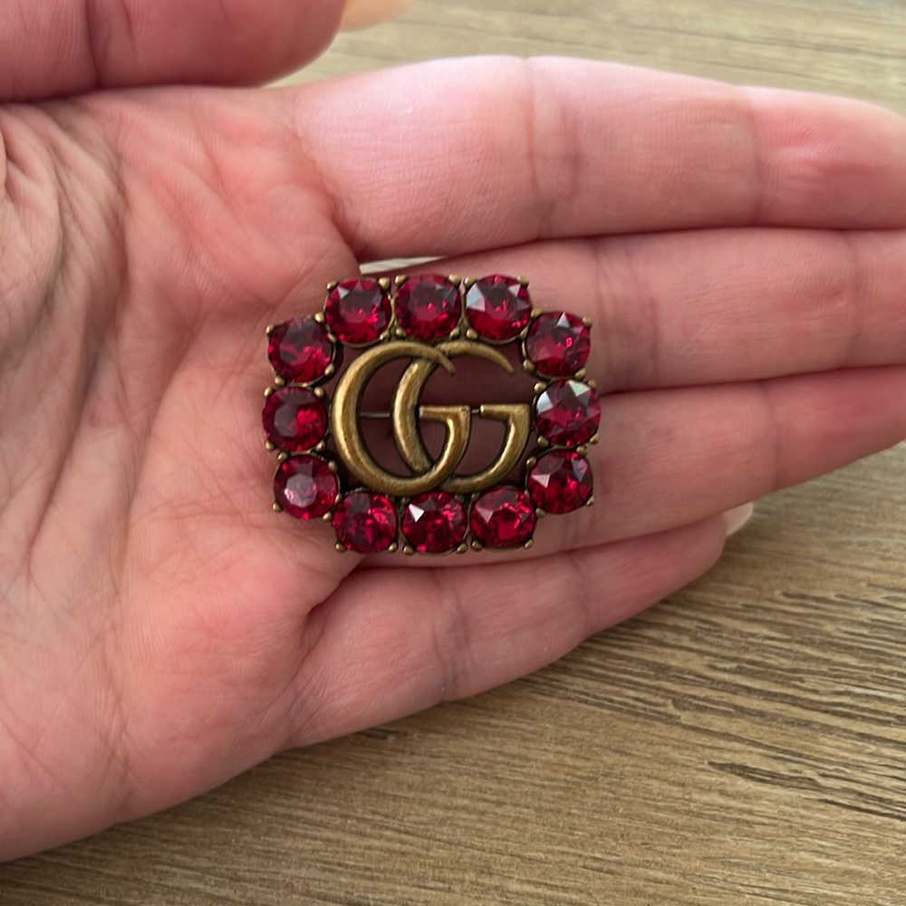 Gucci brooch with red stones